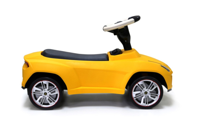 Gul Lamborghini Urus gåbil til børn - med lædersæde og stødabsorberende hjul.