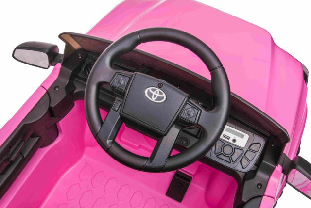 Pink Toyota Tacoma elbil til børn med 2x12V motorer, lædersæde og musikanlæg.