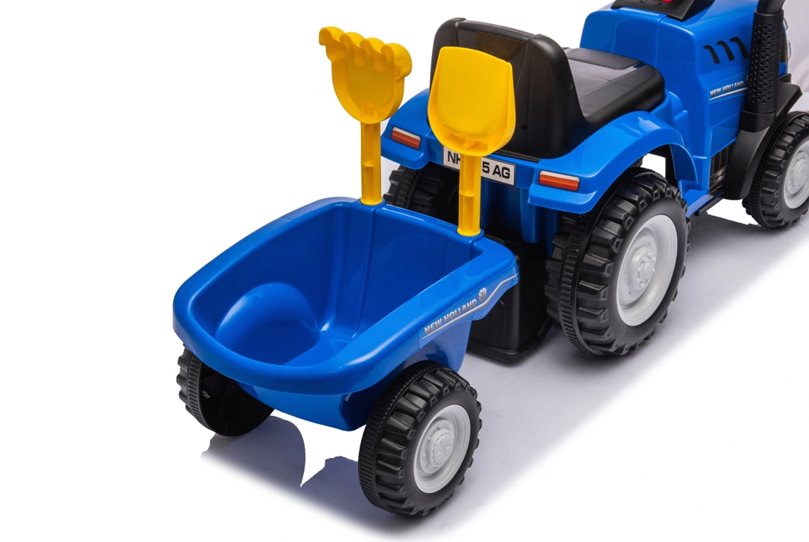 Blå New Holland gå-traktor til børn med trailer, lyd, og værktøj. Passer til børn fra 1-3 år.