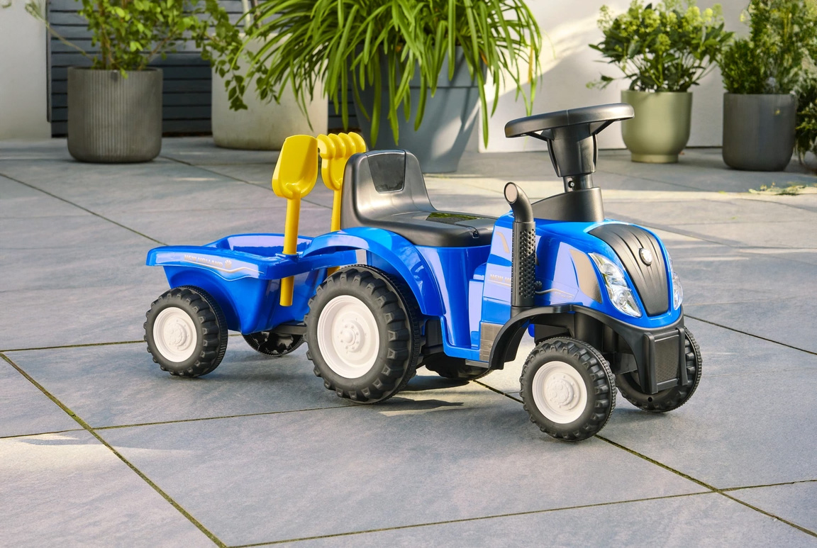 Blå New Holland gå-traktor til børn med trailer, lyd, og værktøj. Passer til børn fra 1-3 år.
