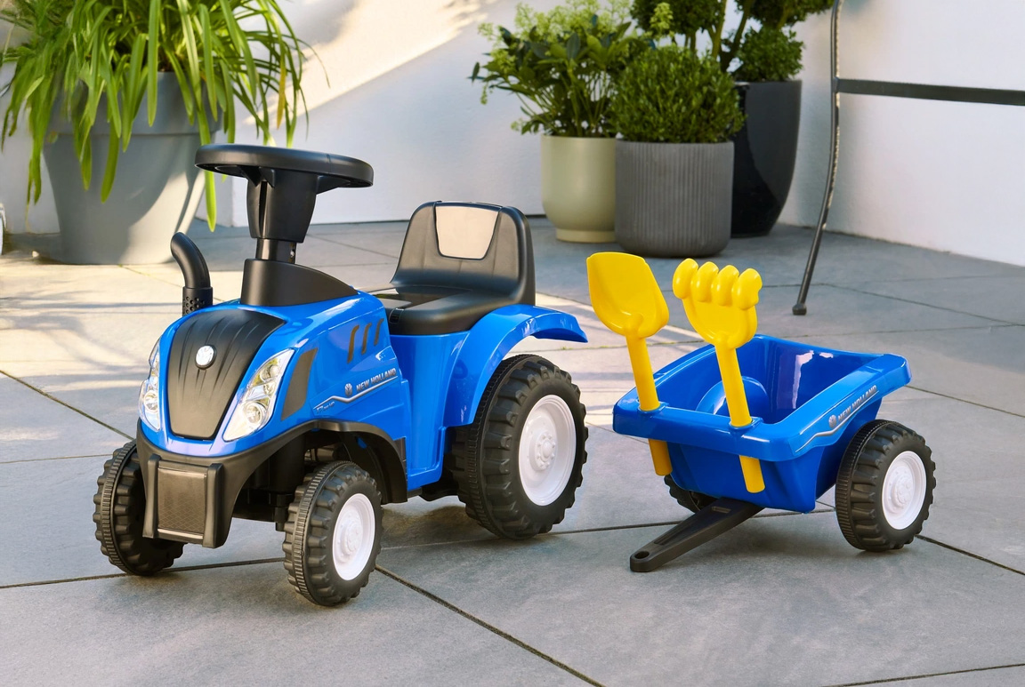 Blå New Holland gå-traktor til børn med trailer, lyd, og værktøj. Passer til børn fra 1-3 år.